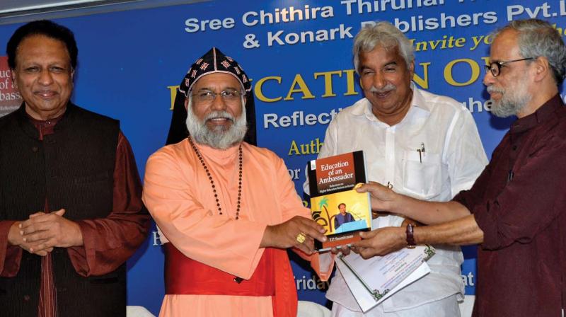 Former Higher Education council chief T.P. Sreenivasan is all smiles as Cardinal Baselious Cleemis hands over a copy of the book Education of an ambassador to Higher Education council chief Rajan Gurukkal at a function in Thiruvananthapuram on Friday as former chief minister Oommen Chandy looks on. (Photo: DC)
