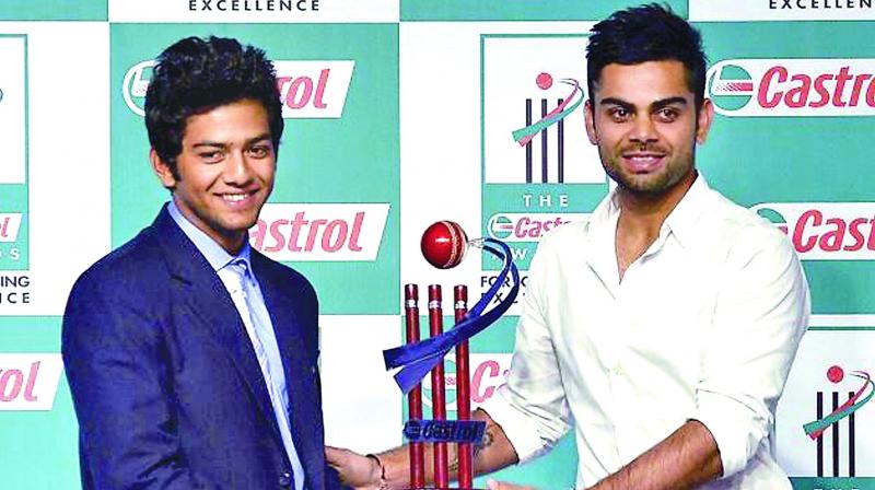 A file photo of Unmukt Chand (left), captain of the 2012 U-19 World Cup-winning team, and Virat Kohli, who led India to title triumph in the 2008 edition.