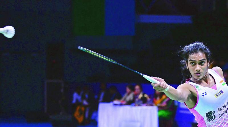 P.V. Sindhu returns a shot to Beiwen Zhang of USA in the India Open womens singles final in Delhi on Sunday. Sindhu lost 18-21, 21-11, 20-22.	 AFP