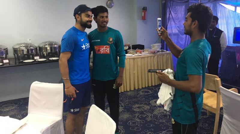 Bangladeshi youngsters took selfies with Virat Kohli after the Hyderabad Test. (Photo: BCCI)