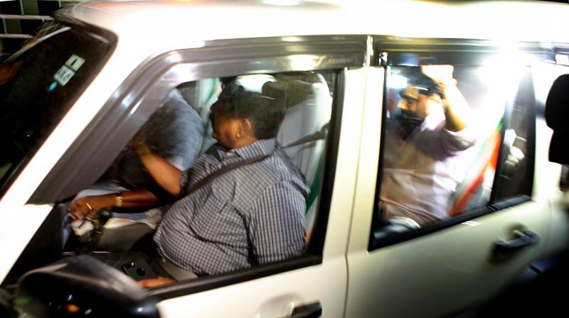 Dileep being brought to Aluva Police club on Monday night. Rural SP, A.V. George, (L) is also seen.
