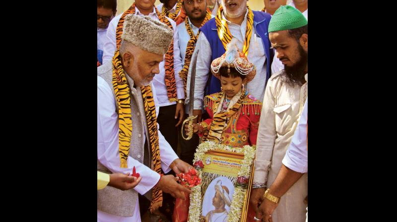 Tipu Sultan United Front members celebrate Tipu Jayanti near Summer Palace in Bengaluru on Friday. (Photo: DC)