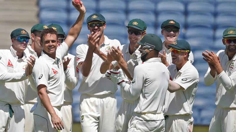Australian bowler Steve OKeefe celebrates his six wickets during the first test match played against India in Pune on Friday. (Photo: AP)