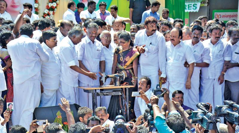 Former Chief Minister O. Paneerselvam, distributes freebies at R.K. Nagar  constituency on Friday. (Photo: DC)
