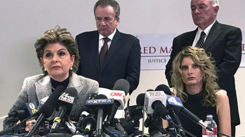 Attorney Gloria Allred, left, sits next to her client, Summer Zervos, during a news conference. (Photo: AP)