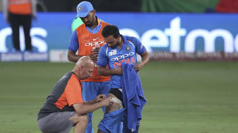 Kedar Jadhav was looked into by the physio Patrick Farhart and decided to continue batting before he went off soon after. (Photo: AP)
