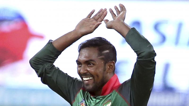 The first Indian wicket to fall was Shikhar Dhawan for 15 runs, and Bangladeshs Nazmul Islam celebrated it in their popular Nagin dance style. (Photo: AP)