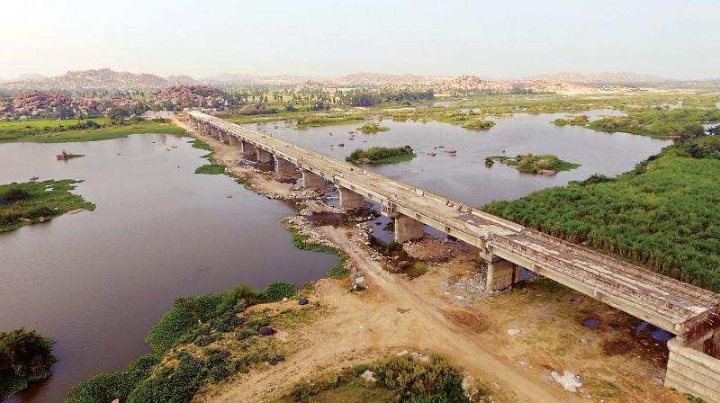 The much-awaited bridge re-establishing the link between Hampi, the erstwhile seat of Vijayanagar empire, with Anegundi, the cradle of the Vijayanagar empire was thrown open to traffic on Tuesday though it is yet to be officially inaugurated. It has 14 pillars and was built at a cost of Rs 32 crore across the river Tungabhadra.