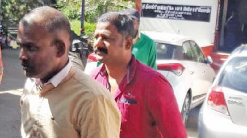 Manoj and Sayan, the accused in the Kodanad estate break-in case, appear before  district and sessions court in Ooty on Tuesday. (Image DC)