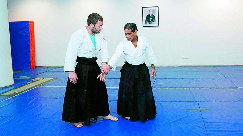 Rahul Gandhi shows different moves of the martial art, while training with Pritos Kar.