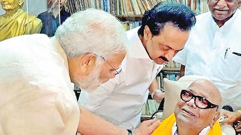 PM Narendra Modi drew a warm smile from DMK president M. Karunanidhi when he called on him at his Gopalapuram residence on Monday. DMK working president Stalin is seen aiding his father while Union minister Pon Radhakrishnan looks on with a happy smile.