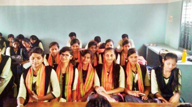 Students attend classes wearing saffron shawls at the Government First Grade College in Koppa of Chikkamagaluru
