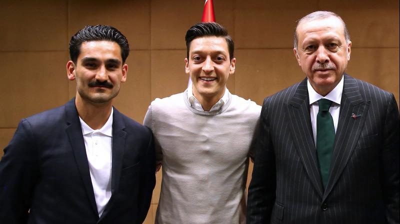 Ilkay Gundogan and Mesut Ozil, who were born in Gelsenkirchen to Turkish parents, were jeered and whistled by fans during pre-World Cup friendlies after posing for a photo alongside Turkish President Recep Tayyip Erdogan. (Photo: AFP)