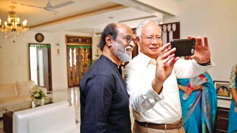 Malaysian Prime Minister Dato Sri Mohd Najib bin Tun Adbul Razak clicks a selfie with Tamil superstar Rajinikanth at his residence in Chennai on Friday. (Photo: DC)