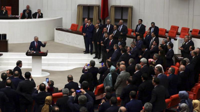 Turkeys parliament approved a contentious constitutional reform package, paving the way for a referendum on a presidential system that would greatly expand the powers of President Recep Tayyip Erdogans office. (Photo: AP)