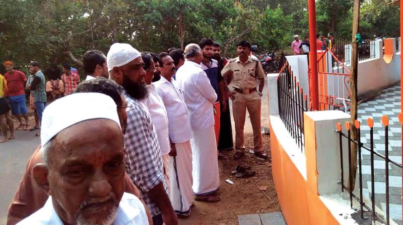 People gather outside Bhajan Mandir after the incident.