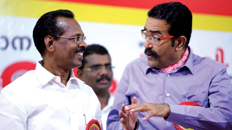 Excise minister T.P. Ramakrishnan and commissioner Rishi Raj Singh interact during Excise Officers state conference in Kozhikode on Saturday. (Photo: DC)