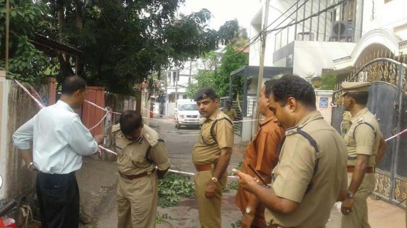 Police officials led by city commissioner Sparjan Kumar inspecting site where the RSS leader was hacked at Sreevaraham on Saturday. (Photo: DC)