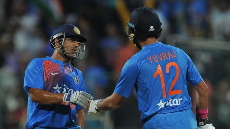 Mahendra Singh Dhoni and Yuvraj Singh went on a rampage against the England bowlers, to help India post a massive total of 202 in the Bengaluru T20 international. (Photo: AFP)