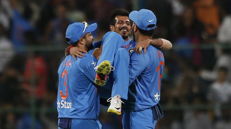 Yuvraj Singh had picked up Yuzvendra Chahal on his lap, after the leggie picked up his sixth wicket against England in Bengaluru. (Photo: AP)