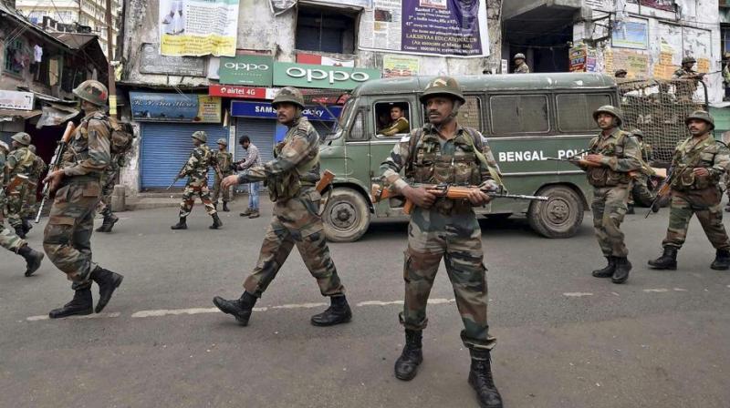 Security personnel patrol a road during a GJM strike in Darjeeling on Saturday. (Photo: PTI)