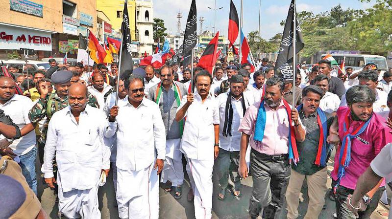 DMK members led by their leader M K Stalin stage protest against delay in the formation of Cauvery Management Board at Anna Salai on Thursday.