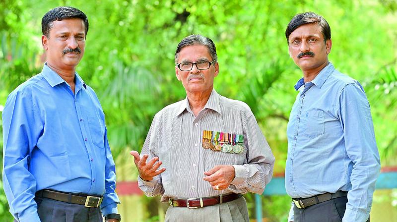 Wing Commander, T.J. Reddy (VSM) (retd)(centre) along with two of his sons who also served in the Indian Air Force, (left) Wing commander T. Manohara Reddy (retd) and (right) Wing commander T. Srinath Reddy (retd).