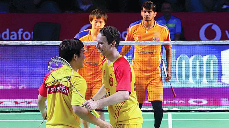 Bengaluru Blasters Kim Sa Rang (left) and Mathias Boe celebrate their victory in the mens doubles semifinal match.