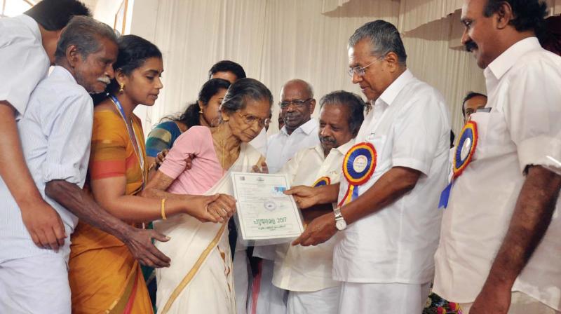 Chief Minister Pinarayi Vijayan distributes title deeds at Kattappana in Idukki on Sunday. (Photo: BY ARRANGEMENT)