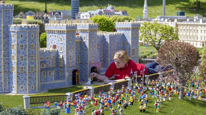 Model maker Lucy Gullon puts the finishing touches to a Lego depiction of the forthcoming wedding of Prince Harry and Meghan Markle, complete with a 39,960 brick version of Windsor Castle, in Legoland Windsor, England. The model took eight model makers 592 hours to build. (Photo: AP)
