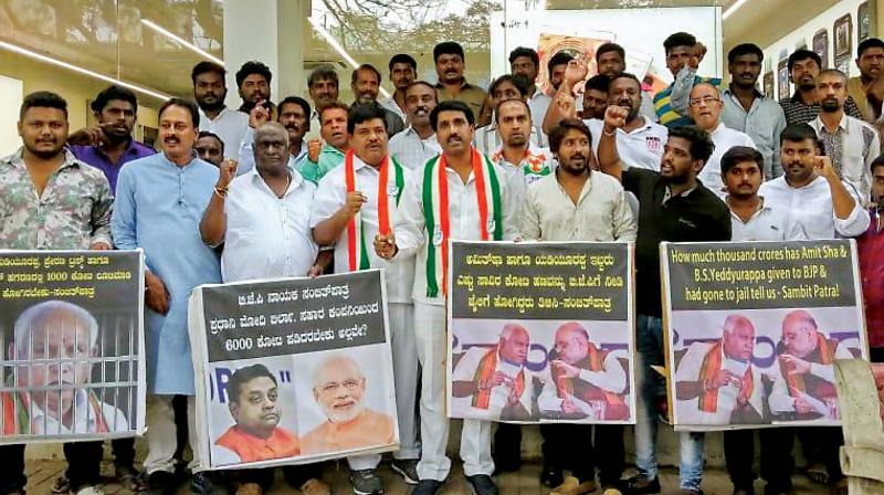 Congress workers protest outside the residence of BJP president B.S.Yeddyurappa in Bengaluru on Thursday soon after CM H.D. Kumaraswamys revolt remark went viral