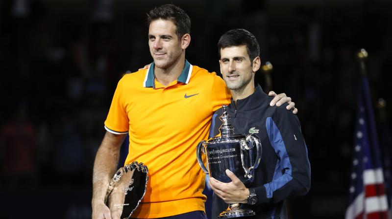 Novak Djokovic clinched his third US Open title with a 6-3, 7-6 (7/4), 6-3 triumph over Juan Martin del Potro, taking him level with Pete Samprass mark of 14 Grand Slams. (Photo: AP)