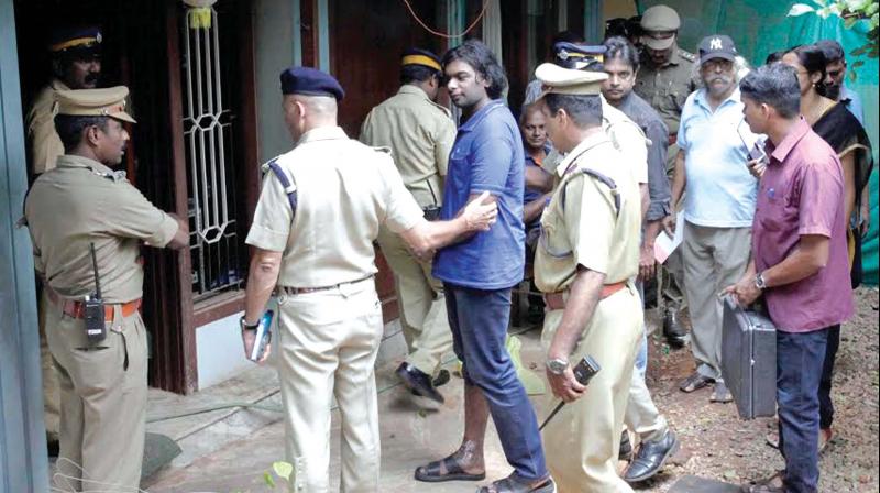 Multiple murder accused Cadell Jeansen Raja being taken to his house at Nanthancode in Thiruvananthapuram for collecting evidence by a police team led by Cantonment assistant commissioner K.E. Baiju. (Photo: A.V. MUZAFAR)