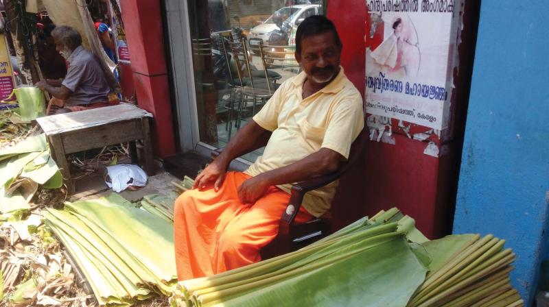 A vendor sells banana leaves at Chalai market on Thursday.