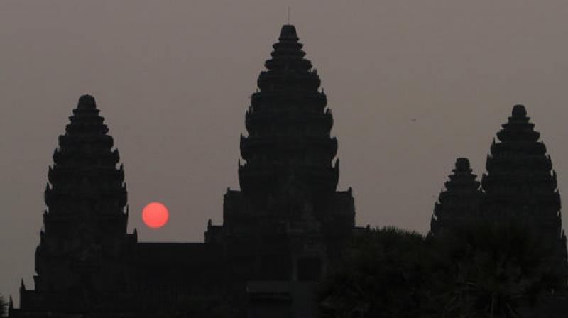 In this March 20, 2015, file photo, the sun rises behind Angkor Wat on the northern outskirts of Siem Reap province, some 230 kilometers northwest of Phnom Penh, Cambodia. (Photo: AP)
