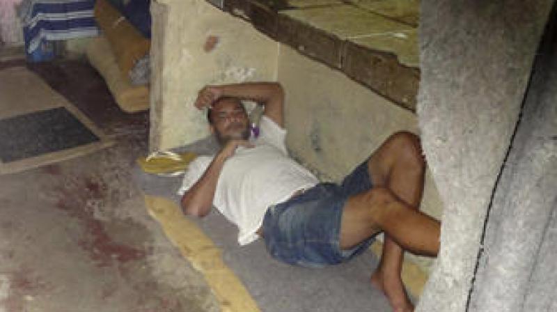 A prisoner on an old mattress at the Instituto Penal Placido de Sa Carvalho in Rio de Janeiro, Brazil. (Photo: AP)