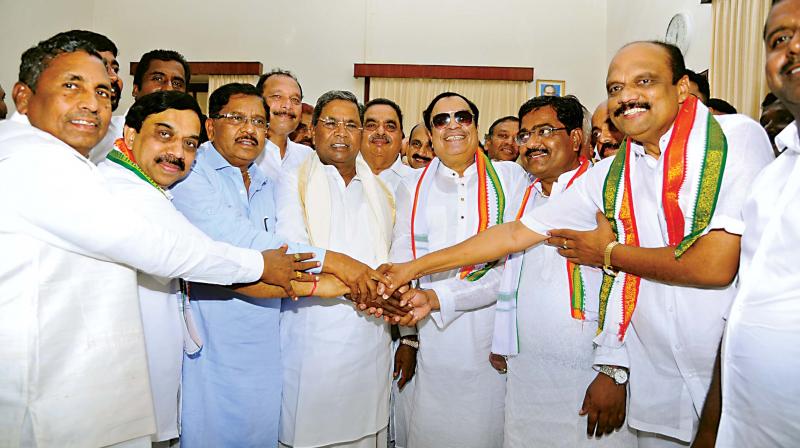 Congress nominees C.M. Ibrahim, K. Govindaraj and Aravind Kumar Arali and below are BJP nominees S Rudregowda, Tejaswini Gowda, Raghunath Rao Malkapure, K.P. Nanjundi Vishwakarma and N. Ravikumar. (Photo:DC)