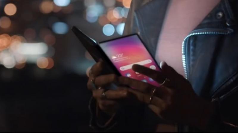 We see Samsung showing off different product concepts that could be released and the most notable device from the promo video being the Galaxy Fold, the foldable smartphone.