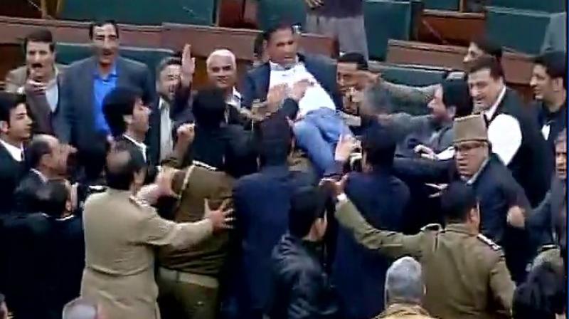 All the Opposition members trooped into the Well, threw chair, files and papers amid protests and uproarious scenes for over half an hour. (Photo: Twitter/ANI)