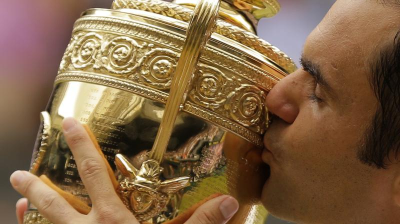 Roger Federer became the first player since Bjorn Borg in 1976 to win Wimbledon without dropping a set in the entire tournament. (Photo: AP)