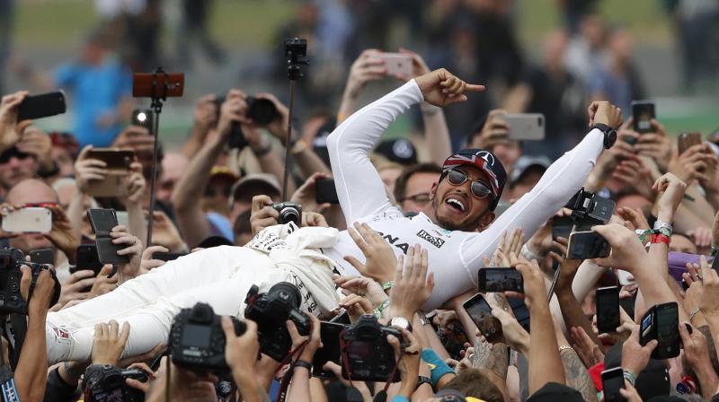Lewis Hamilton cruised to a 57th career win and soaked up the applause from an army of flag-waving fans. (Photo: AP)