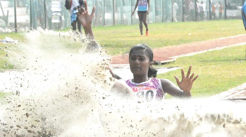 Kozhikode girl Lizbeth Karoline Joseph leaps 12.67m to win gold in the senior girls triple jump in the 60th State School Championship at Thenhipalam on Monday. (Photo: Venugopal)
