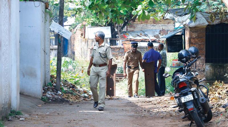 Police officials inspect the art gallery premises on Monday. (Photo: DC)