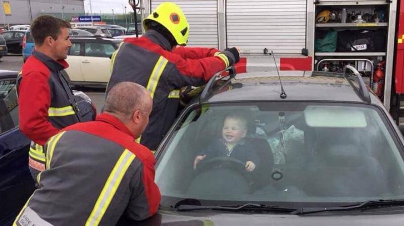 The child unaware of his mischief was busy laughing at the steering wheel while his mother seemed tensed on the outside. (Photo: Twitter/BudeFireStation)
