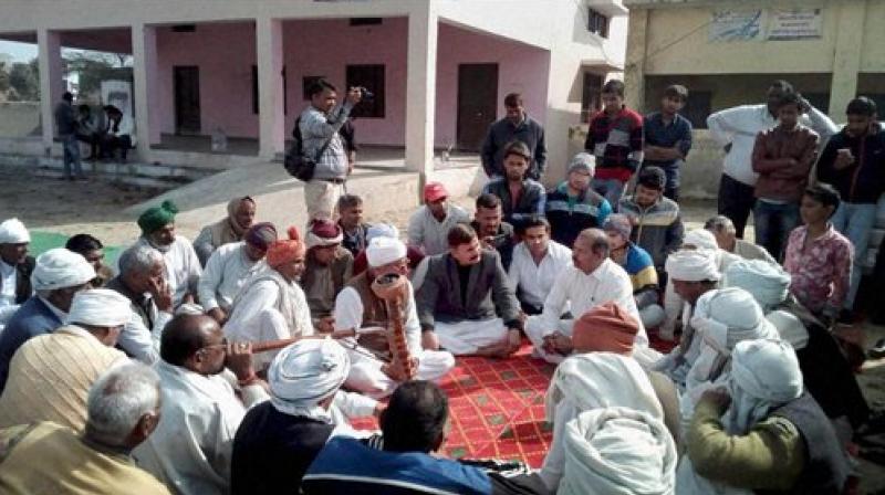 Members of Jat community sit on dharna demanding reservation in Faridabad on Sunday. (Photo: PTI)