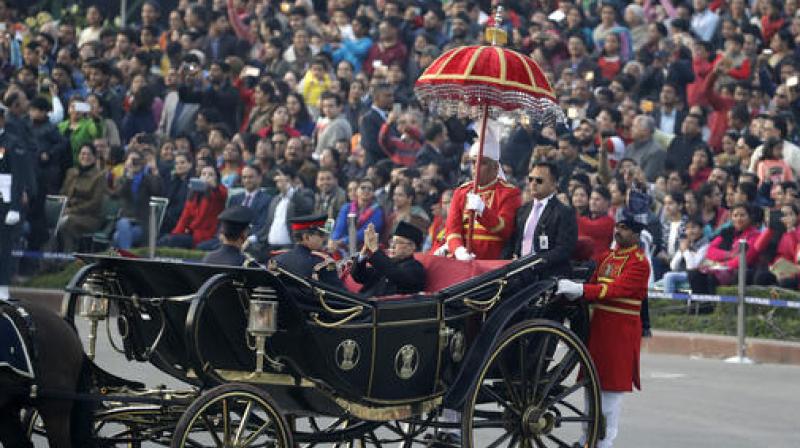 Pranab Mukherjee  Indian President Pranab Mukherjee, greets people as he arrives in traditional buggy during Beating Retreat ceremony in New Delhi, India on Sunday. (Photo: PTI)