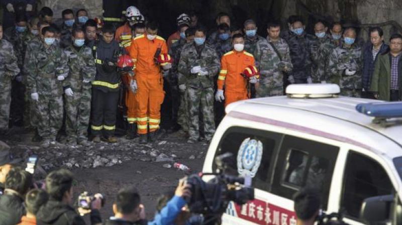 In this Tuesday, Nov. 1, 2016 photo released by Xinhua News Agency, rescuers mourn for victims at Jinshangou Coal Mine in Chongqing, southwest China. (Photo: AP)