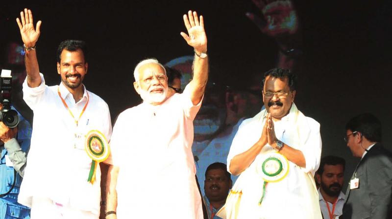 Yuva Morcha state president K. P. Prakash Babu (extreme left) shares dais with Prime Minister Narendra Modi at the Yuva Morcha state meet at Thekkinkkadu grounds, Thrissur, on Sunday.