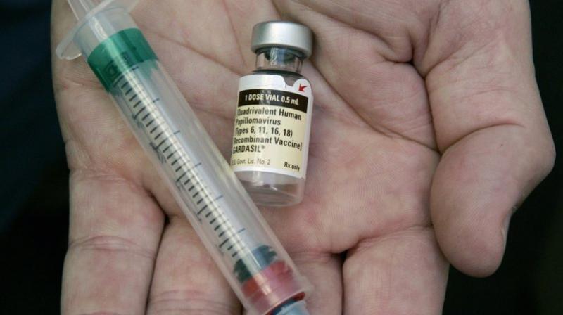 In this Aug. 28, 2006 file photo, a doctor holds a vial of the human papillomavirus (HPV) vaccine Gardasil in his Chicago office. (Photo: AP)