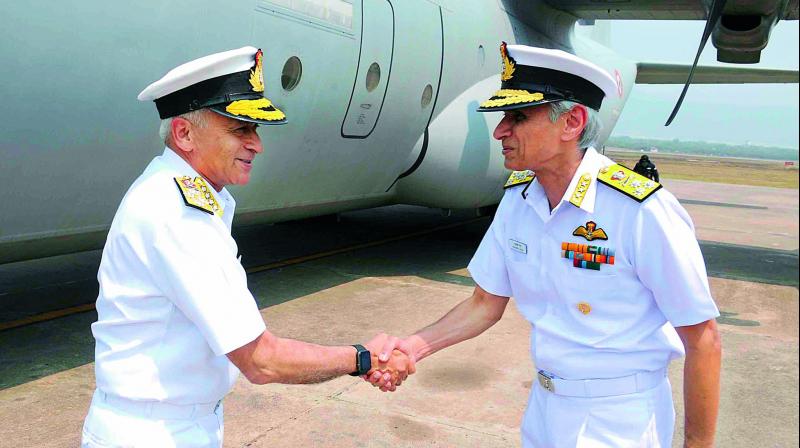 Chief of the Naval Staff, Admiral Sunil Lanba being received by the Commander-in-Chief of ENC, Vice Admiral Karambir Singh on his arrival in Vizag.